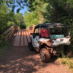 4 person ATV on a trail bridge