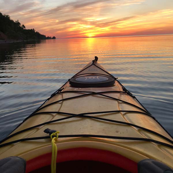 Tip of kayak at sunset on Lake Superior