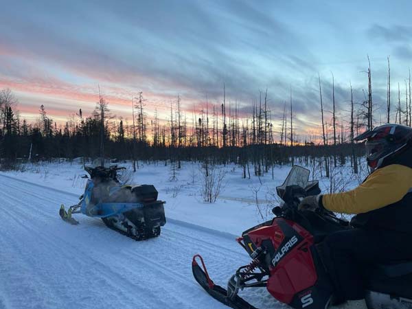 Two snowmobiles